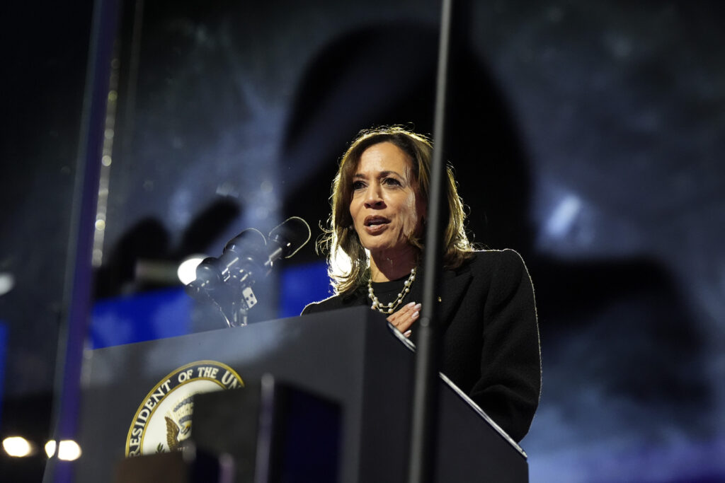 Vice President Kamala Harris at a podium, ready to deliver her concession speech.